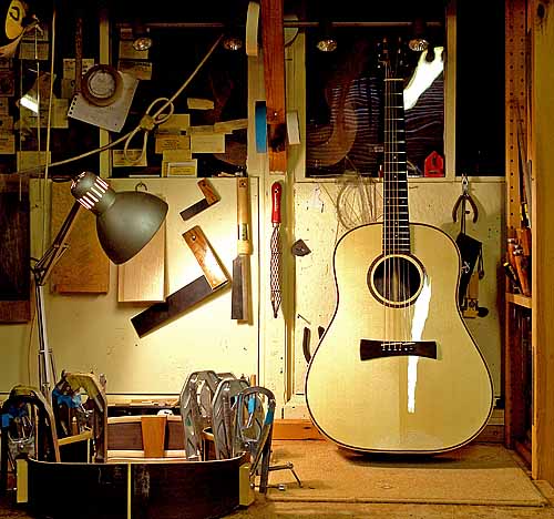 My 14 fret Dreadnought is now lacquered and strung. I’ll leave it a few days to settle before fitting its Highlander pickup and setting the action.<br /><br />It is a little wider than the standard Dreadnought, and has the same body length as my 12 fret model. Most 14 fret Dreadnoughts bodies are a little shorter than 12 fret bodies.<br /><br />Alongside is a Martin Simpson model body with side re-inforcement strips glued and clamped in place.